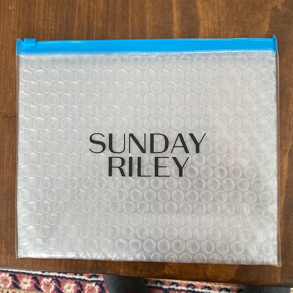 Sunday Riley bubble wrap filled zipper pouch makeup bag